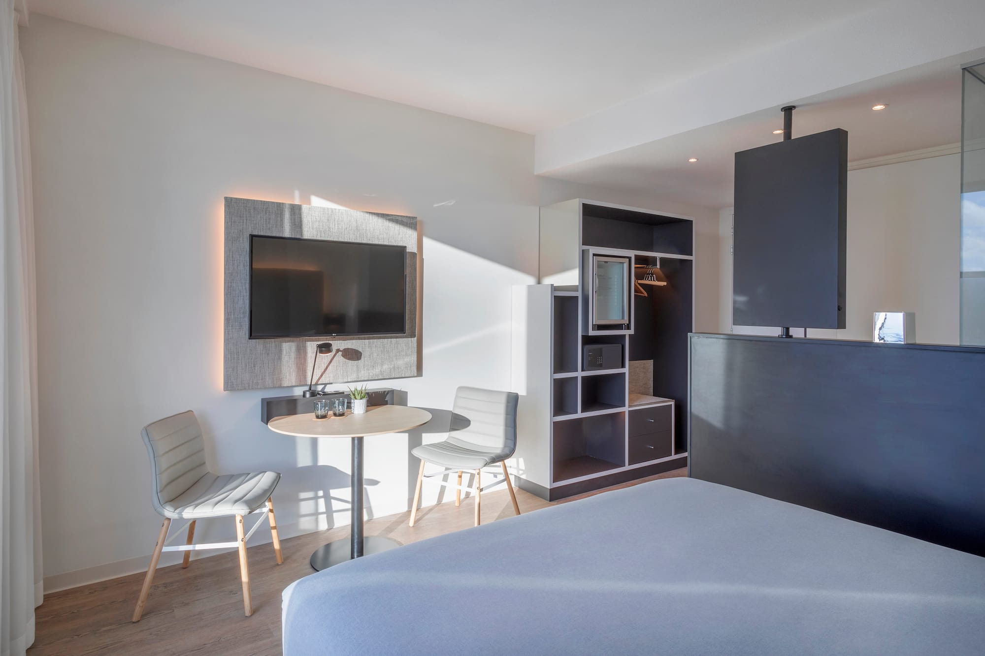 a room with a tv and a table