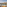 Balcony view of ocean, resort pools, palm trees, and desert hills.