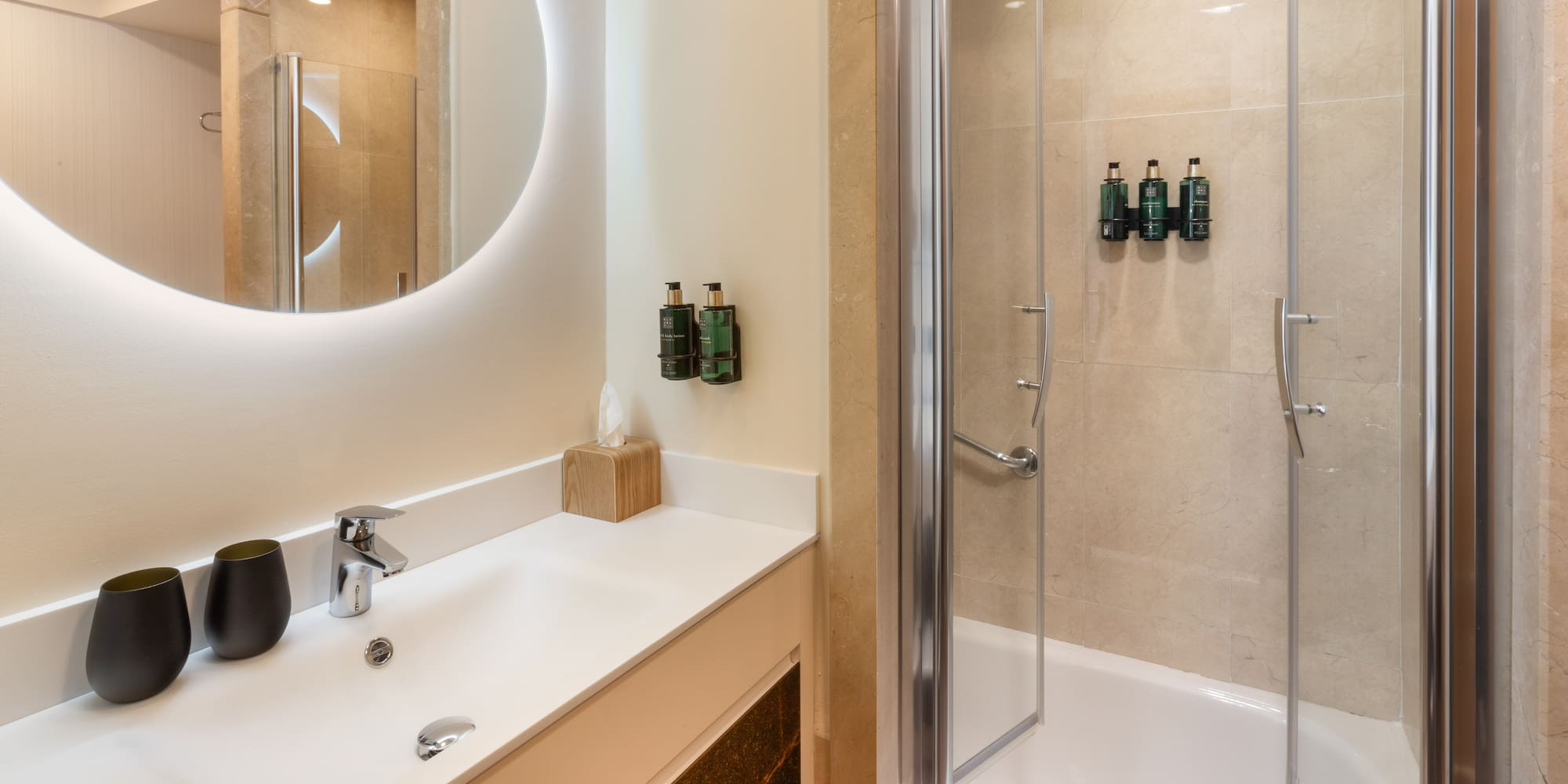 a bathroom with a shower and a sink