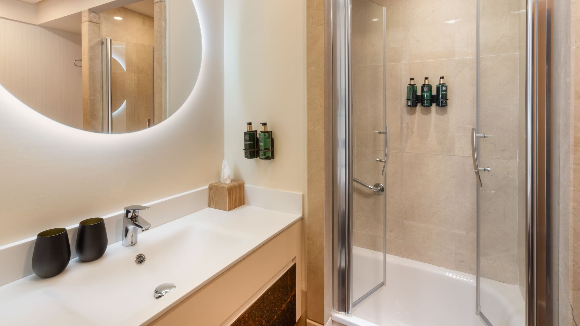 a bathroom with a shower and a sink