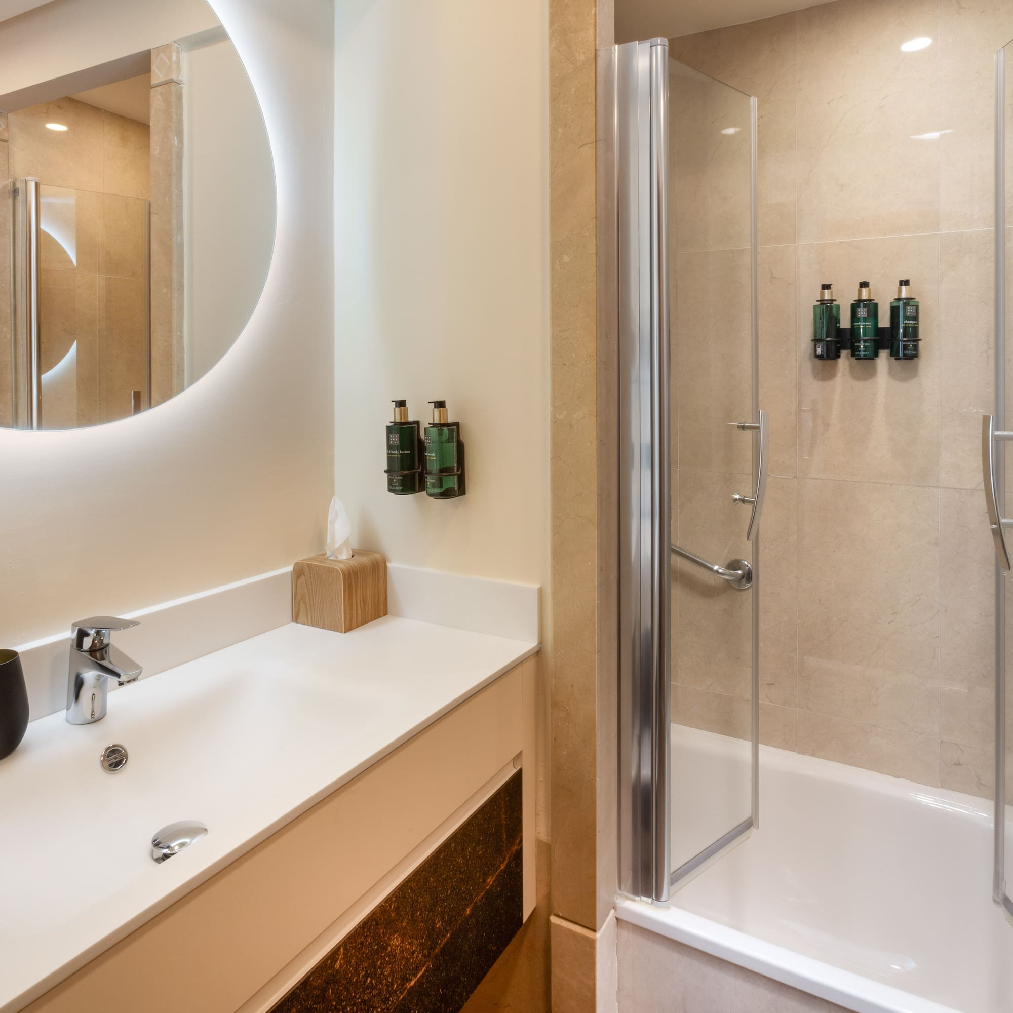 a bathroom with a shower and a sink