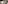 Natura Bisse luxury hotel toiletries: shampoo, conditioner, soap, and towels.