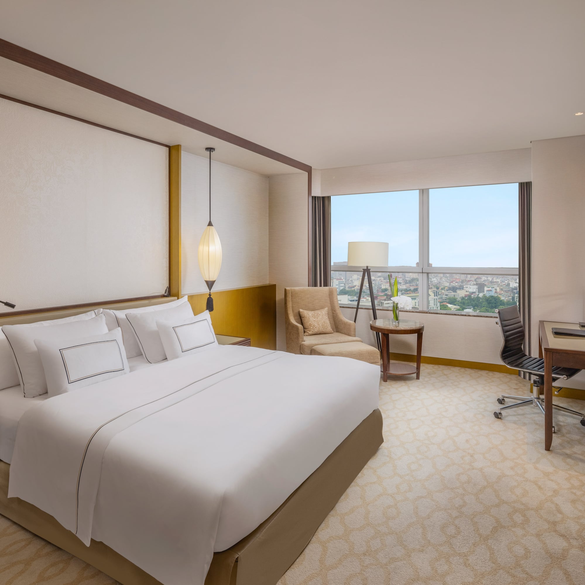 a room with a bed and a desk and chair