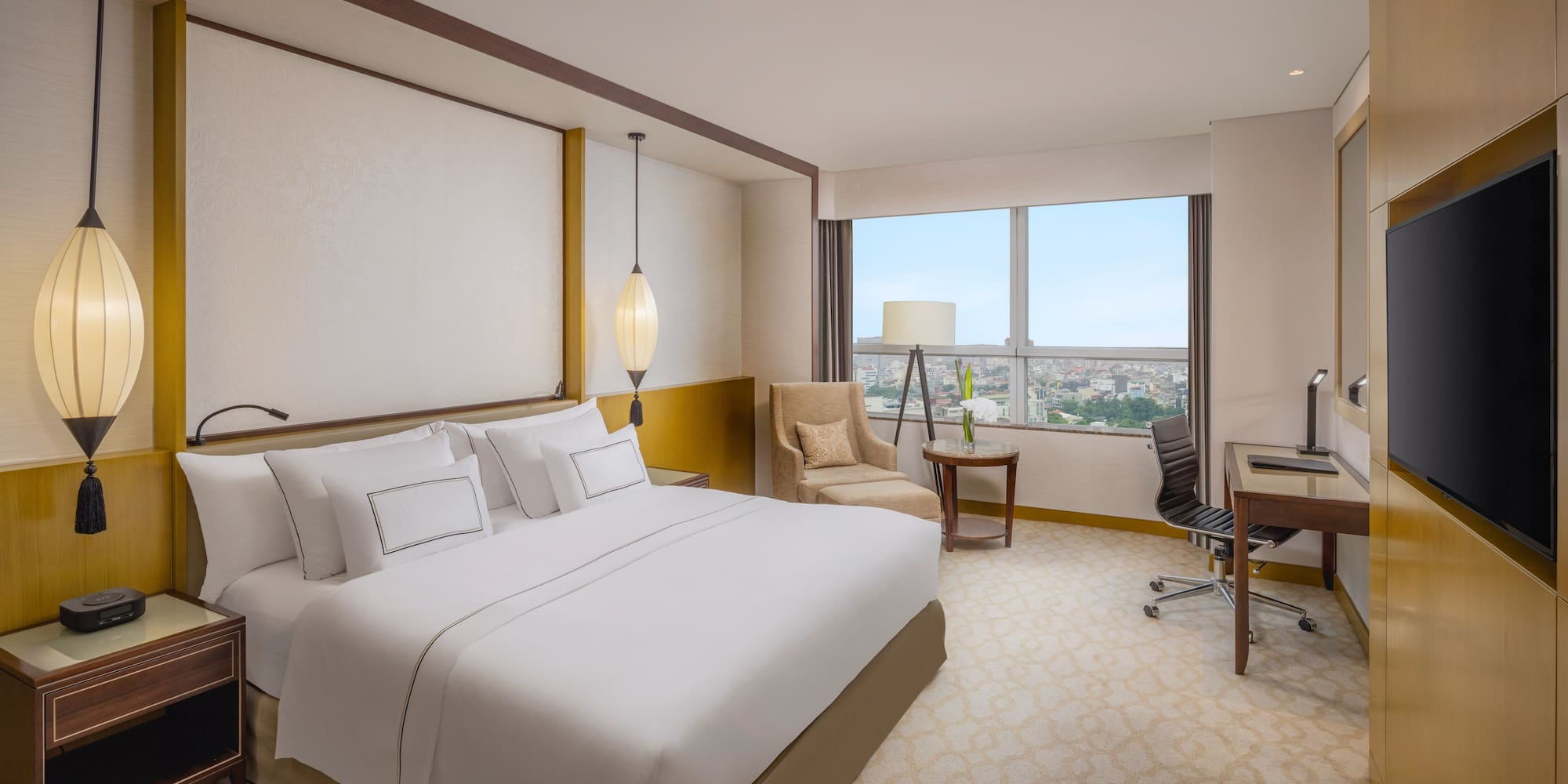 a room with a bed and a desk and chair