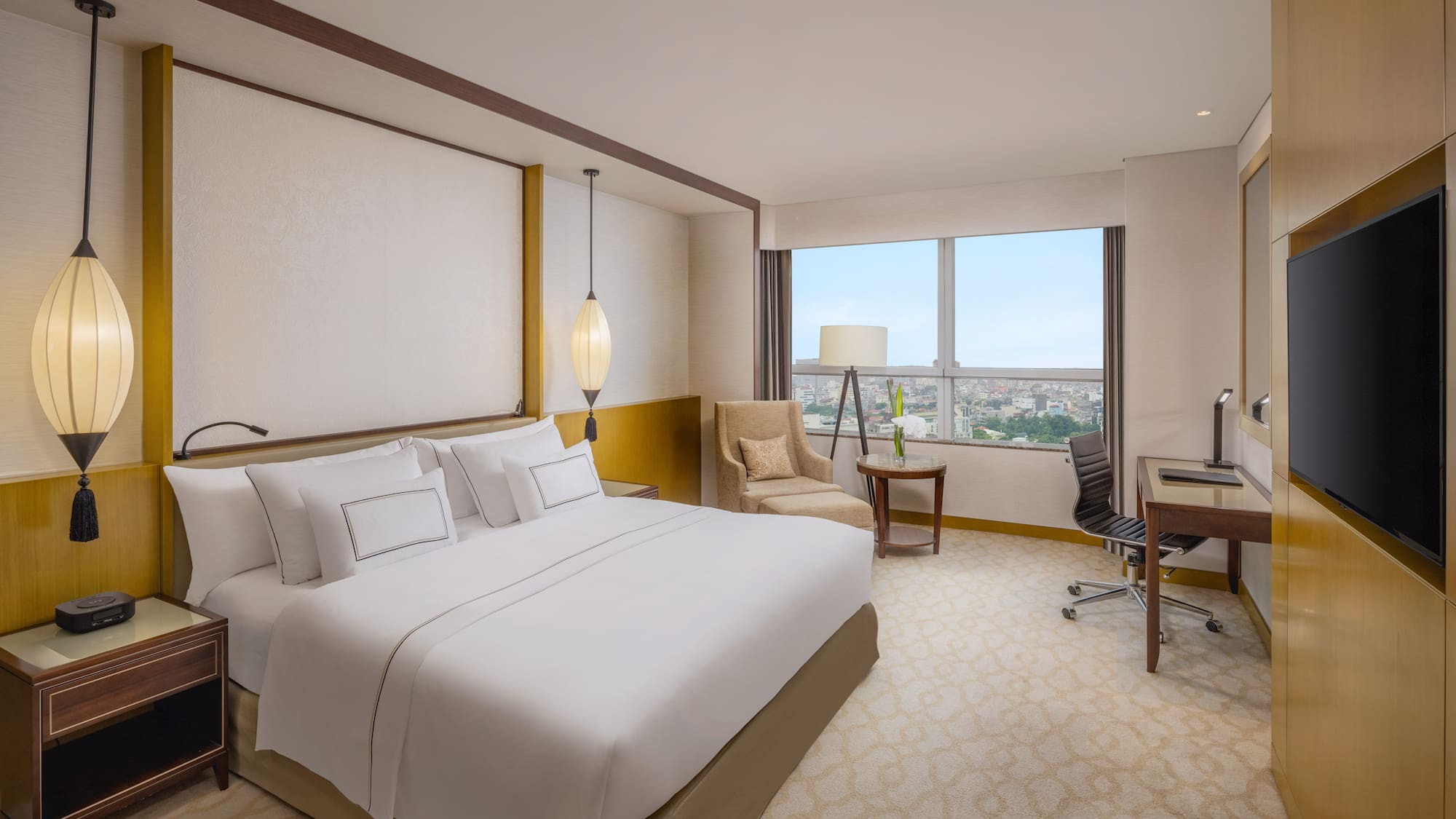 a room with a bed and a desk and chair