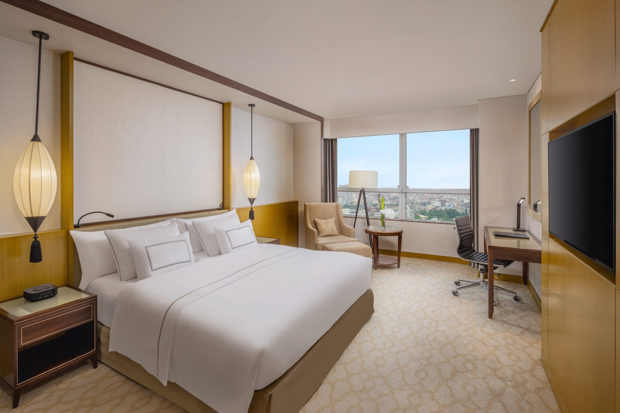 a room with a bed and a desk and chair