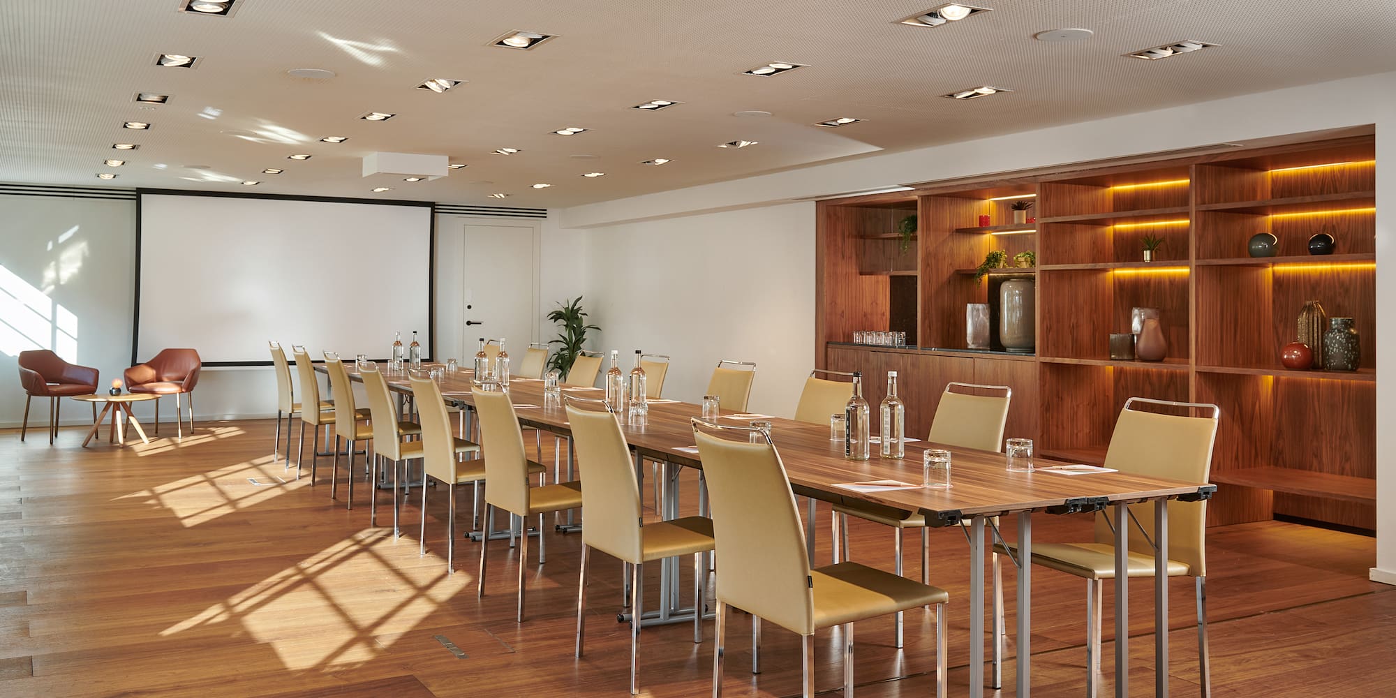 a room with a long table and chairs