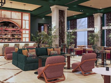 a room with a bar and chairs