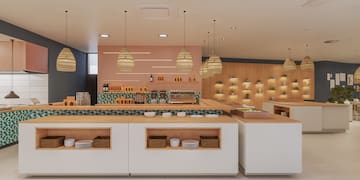 a large room with a counter and shelves