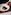 a hand holding a plate of food
