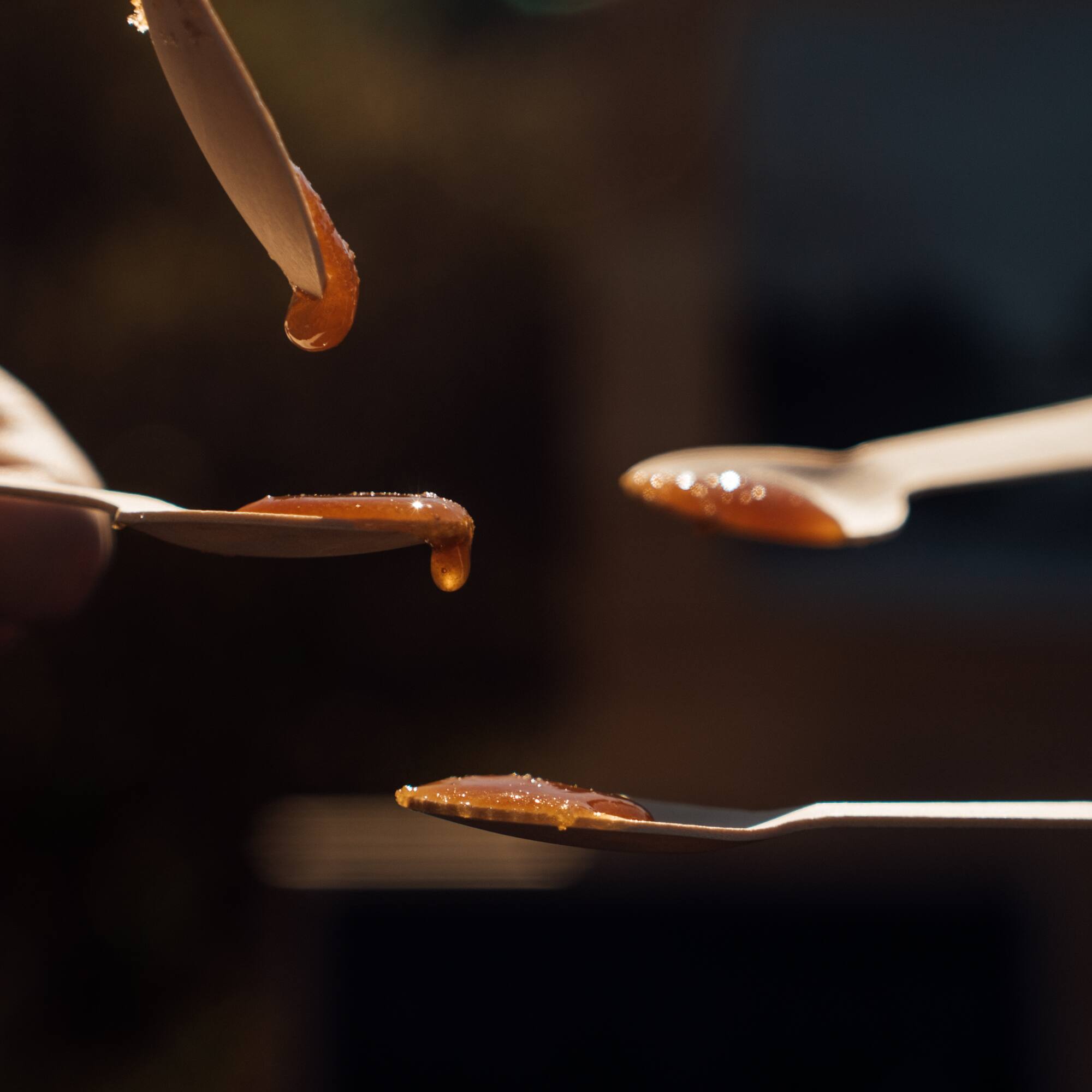 a spoons with brown liquid on them