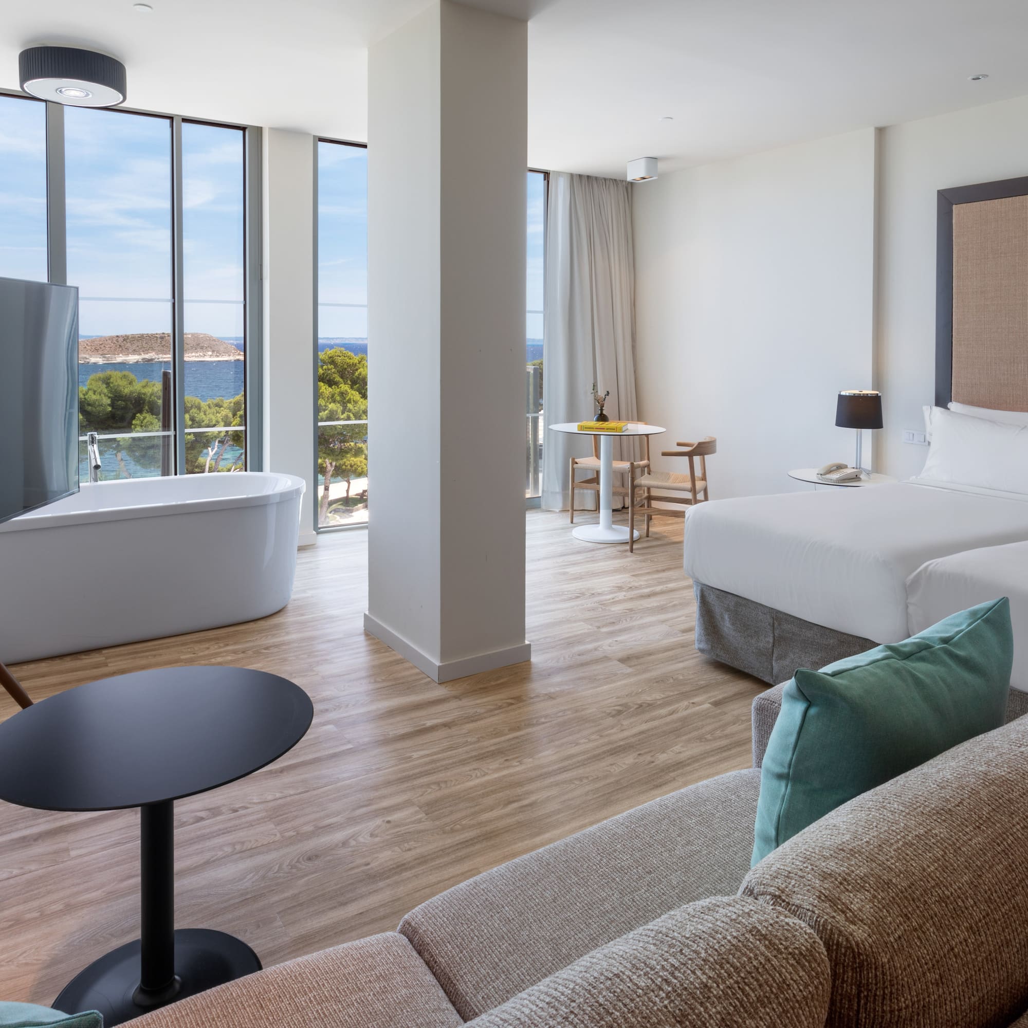 a room with two beds and a tub