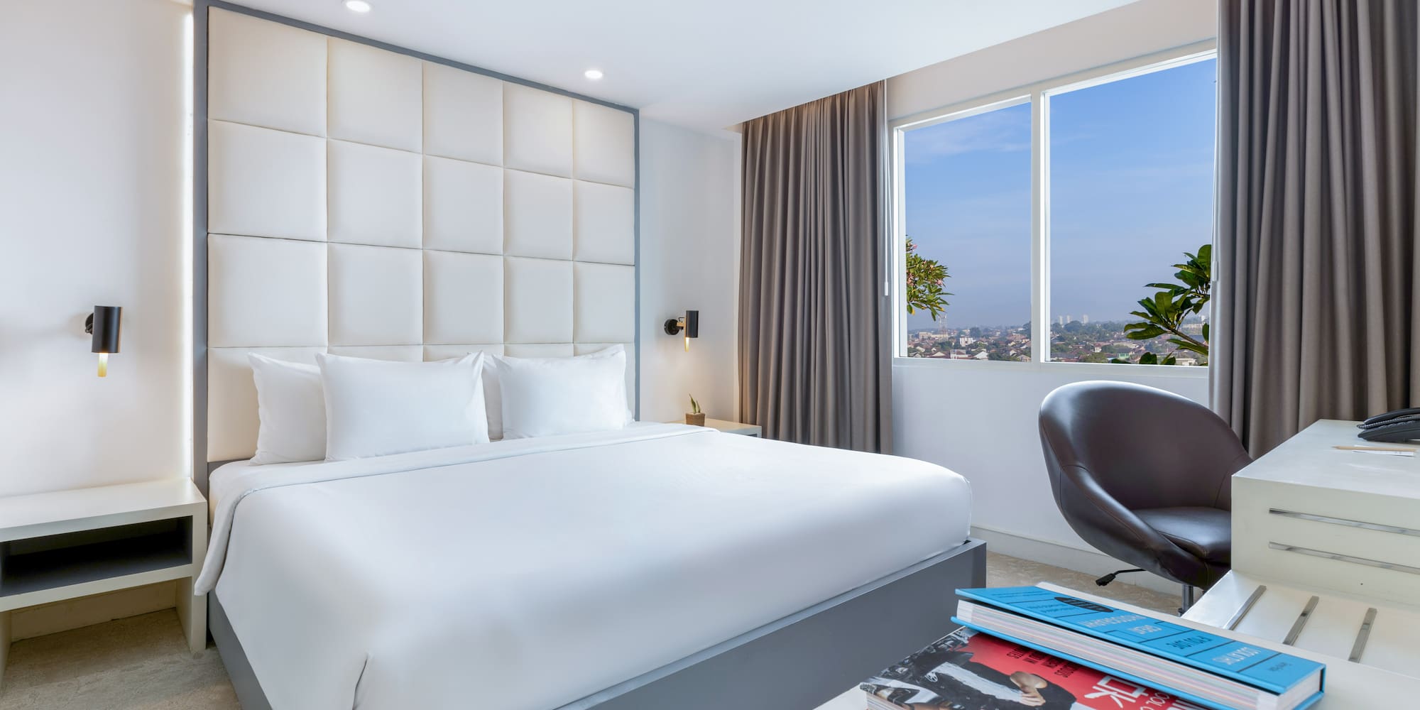 a bedroom with a bed and a chair