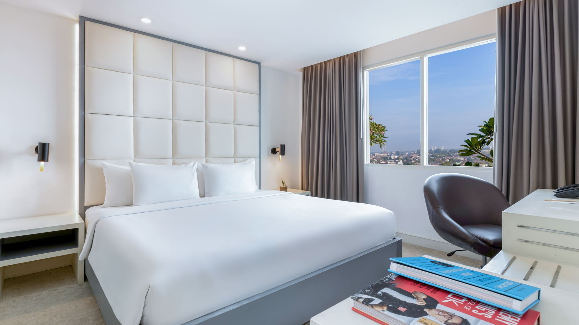 a bedroom with a bed and a chair