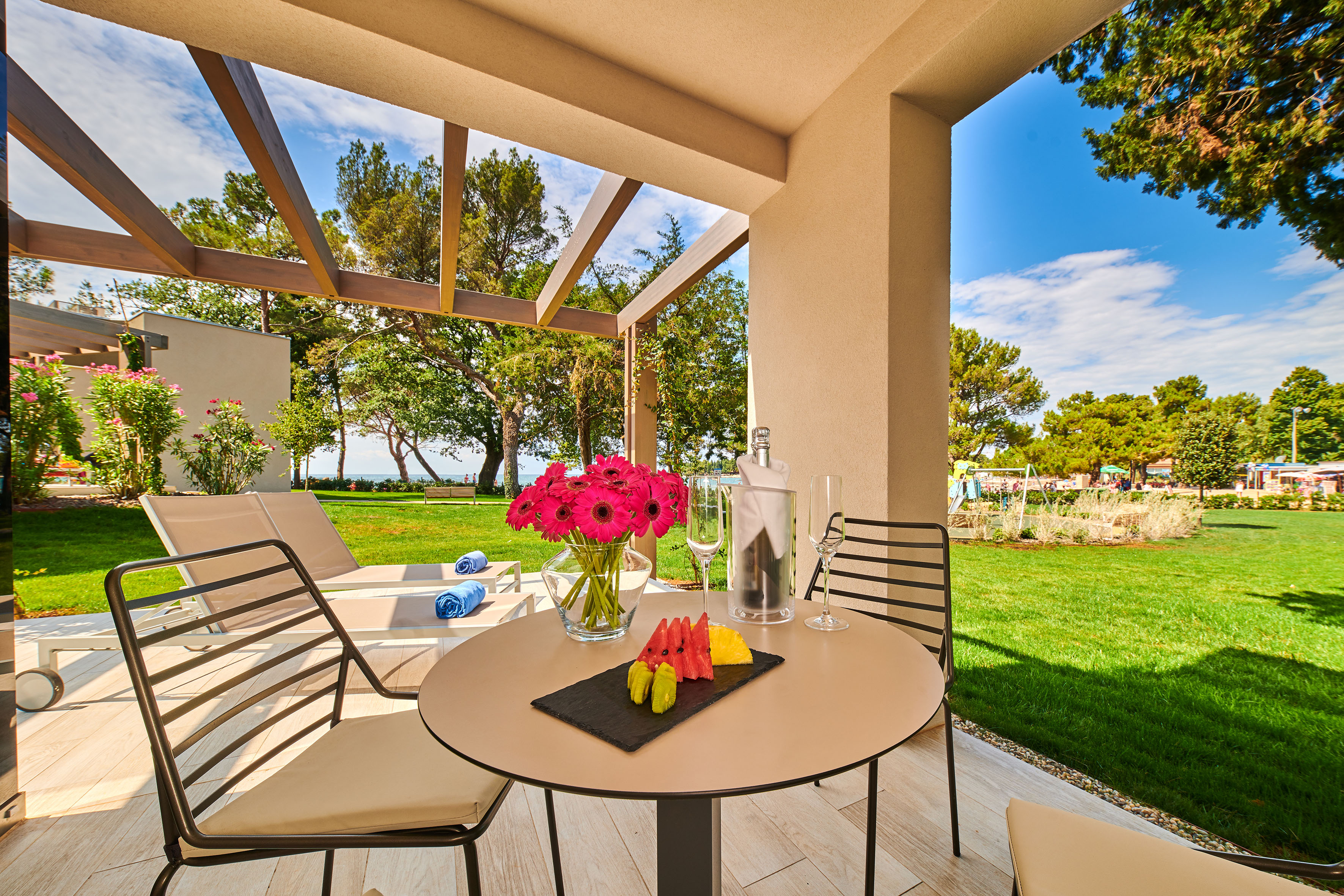 a table with fruit and wine glasses on it - XTRA Suite - Garden Suites Umag Plava Laguna Affiliated by Meliá, Umag