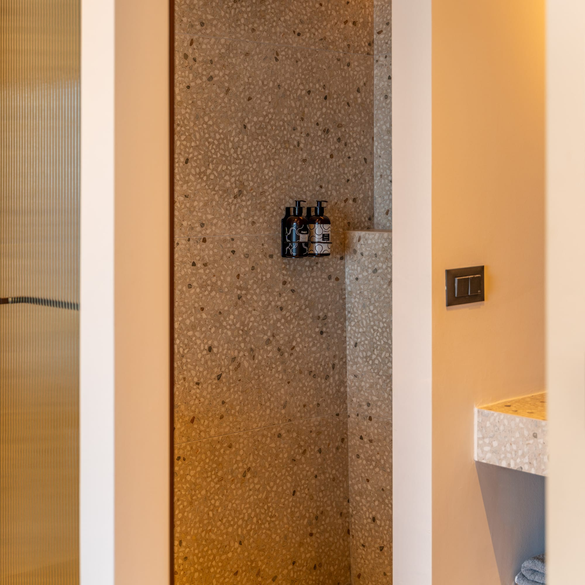 a shower with a shower and a sink