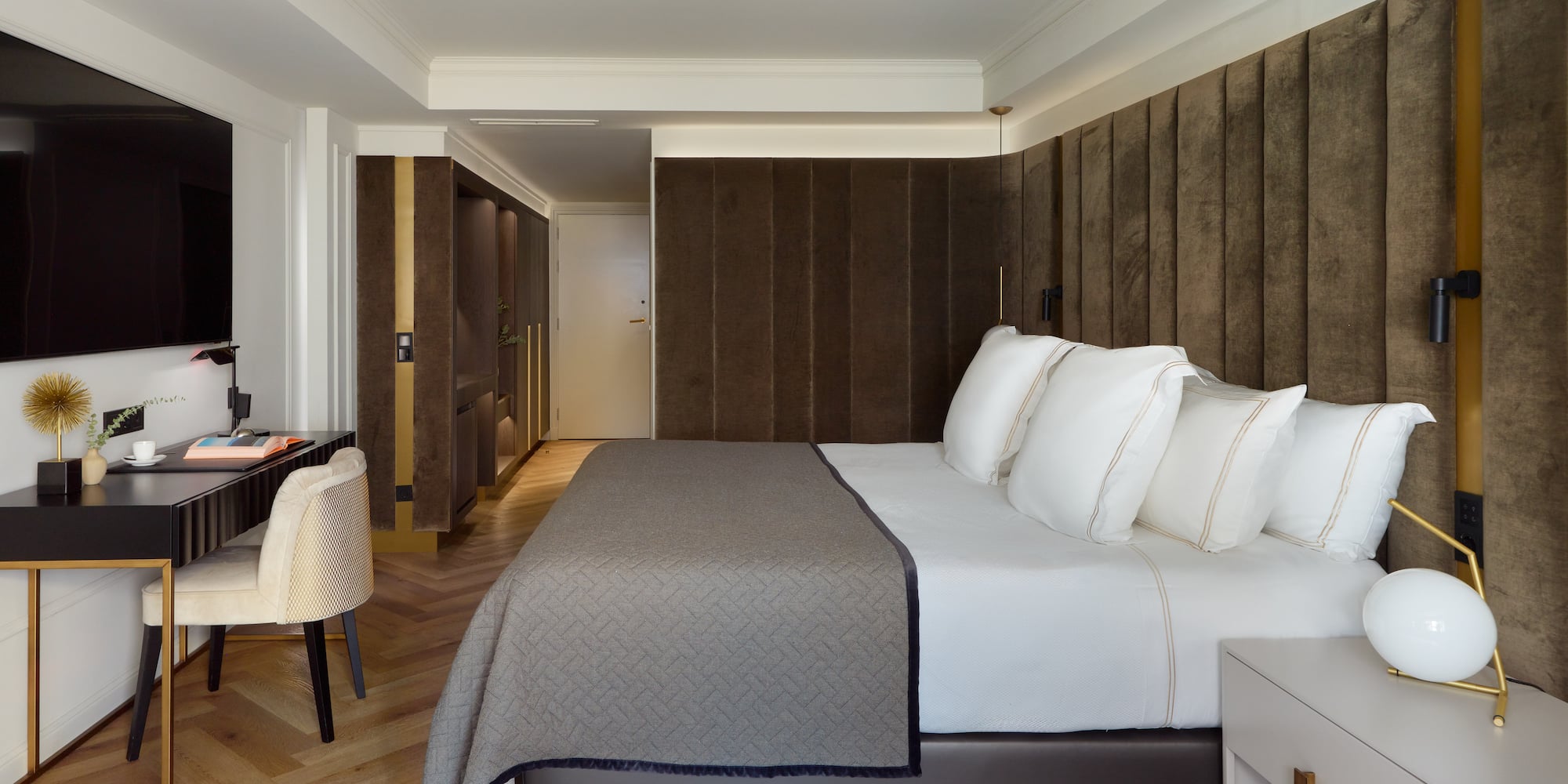 a bed with white pillows in a room