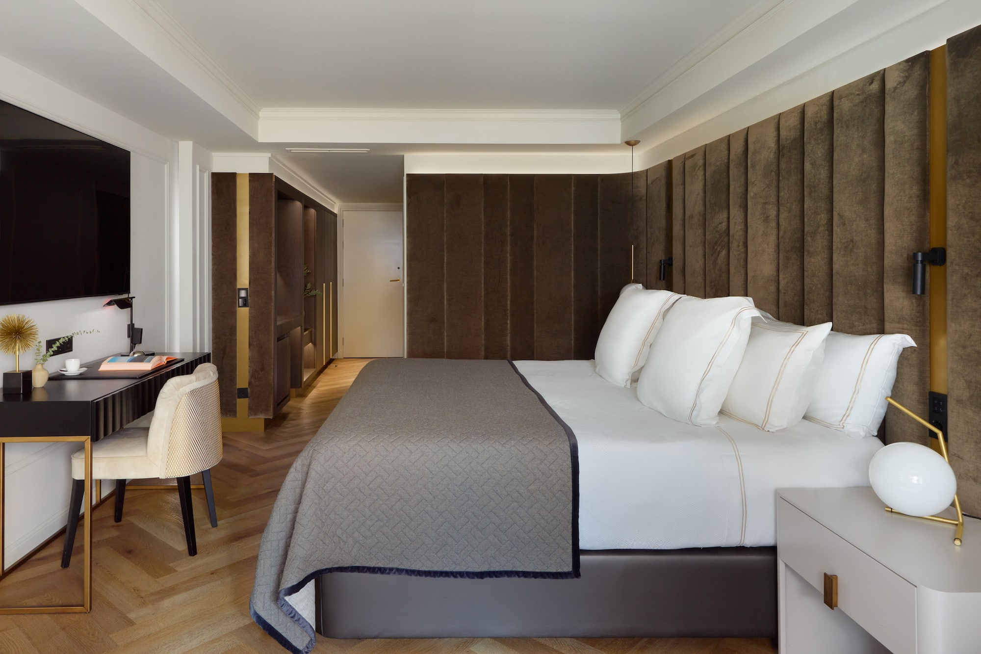 a bed with white pillows in a room