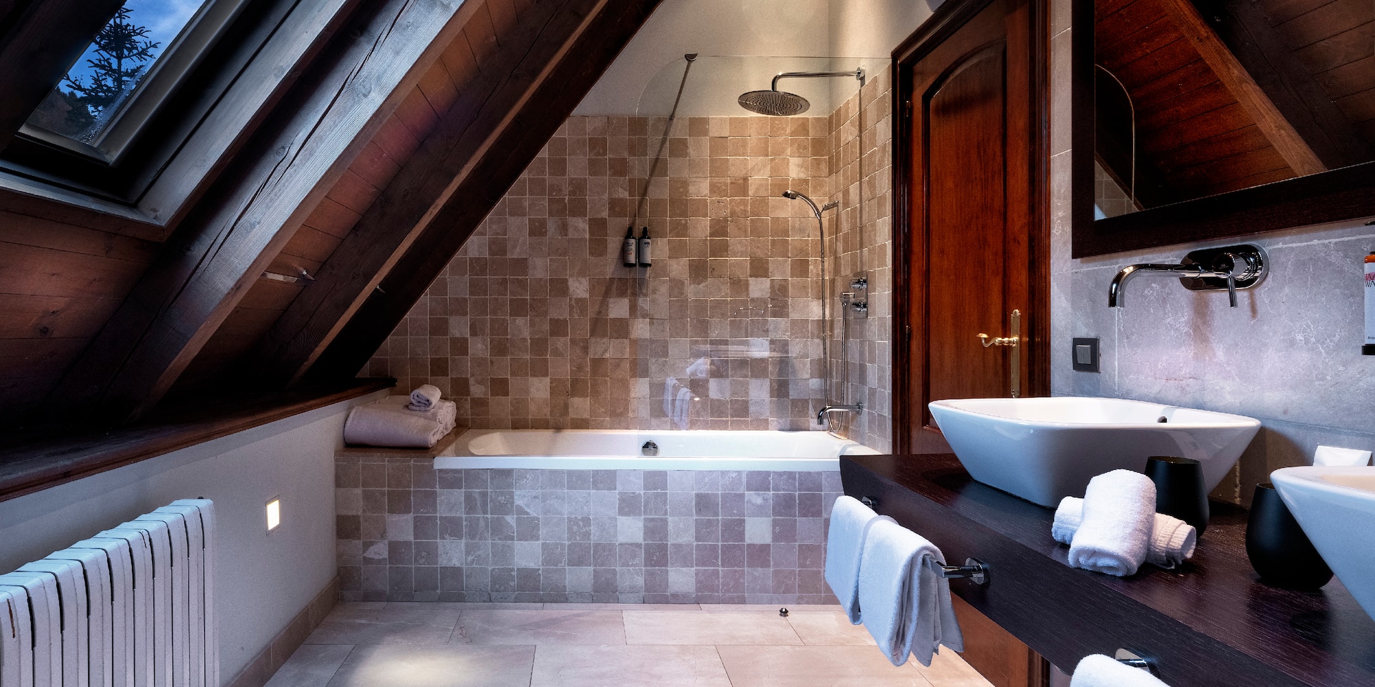 a bathroom with a shower and a sink