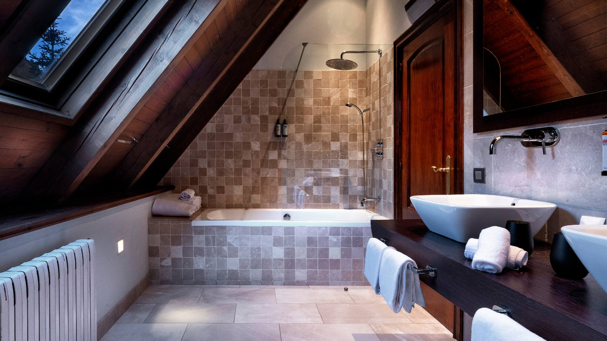 a bathroom with a shower and a sink