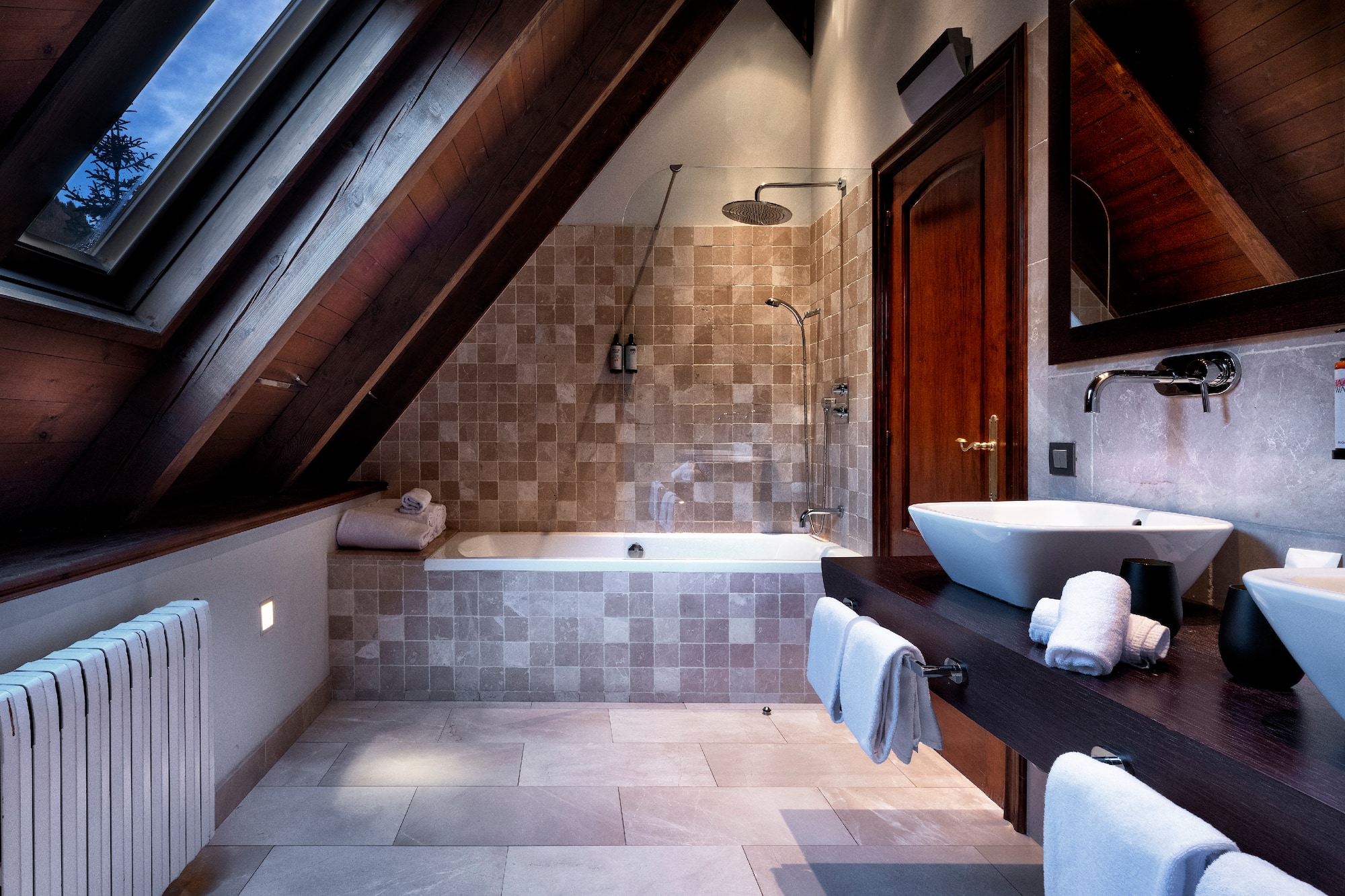 a bathroom with a shower and a sink