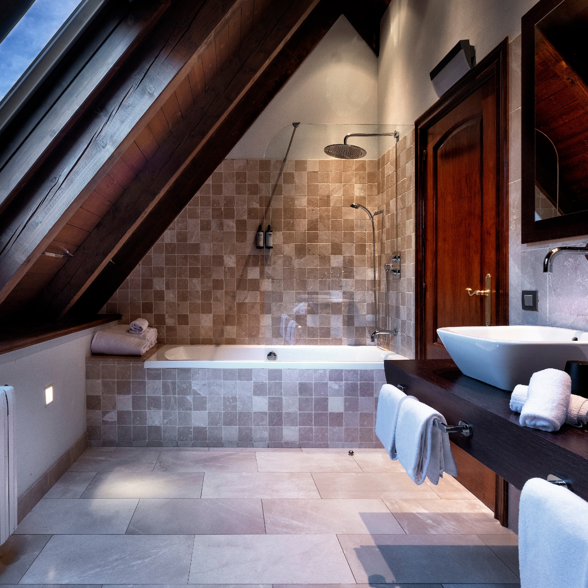 a bathroom with a shower and a sink