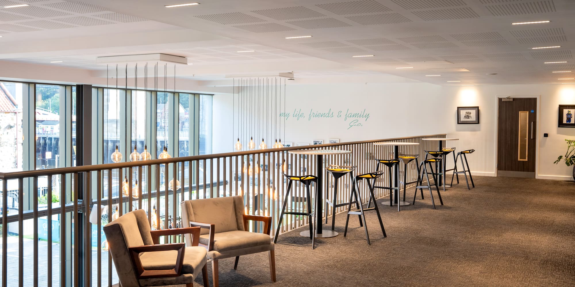 a room with chairs and a railing