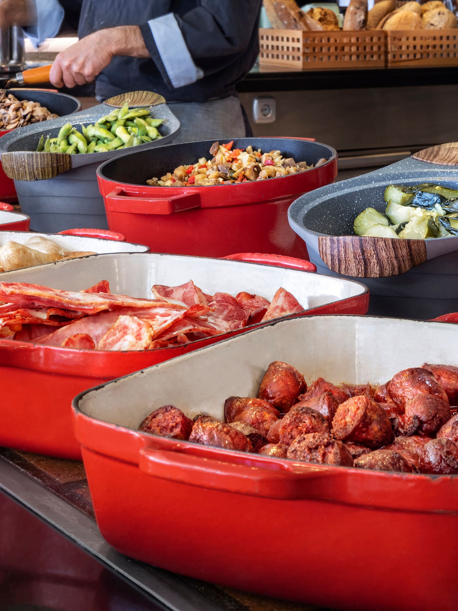 a group of red containers with food in them