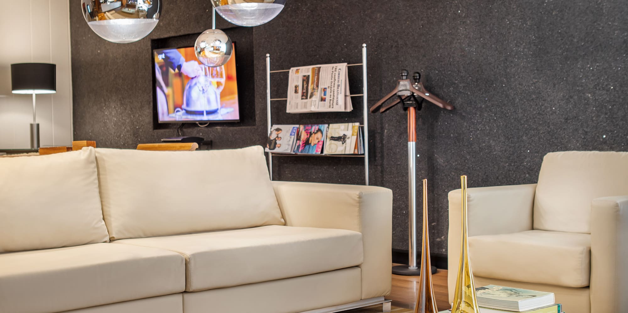 a living room with a white couch and a white coffee table