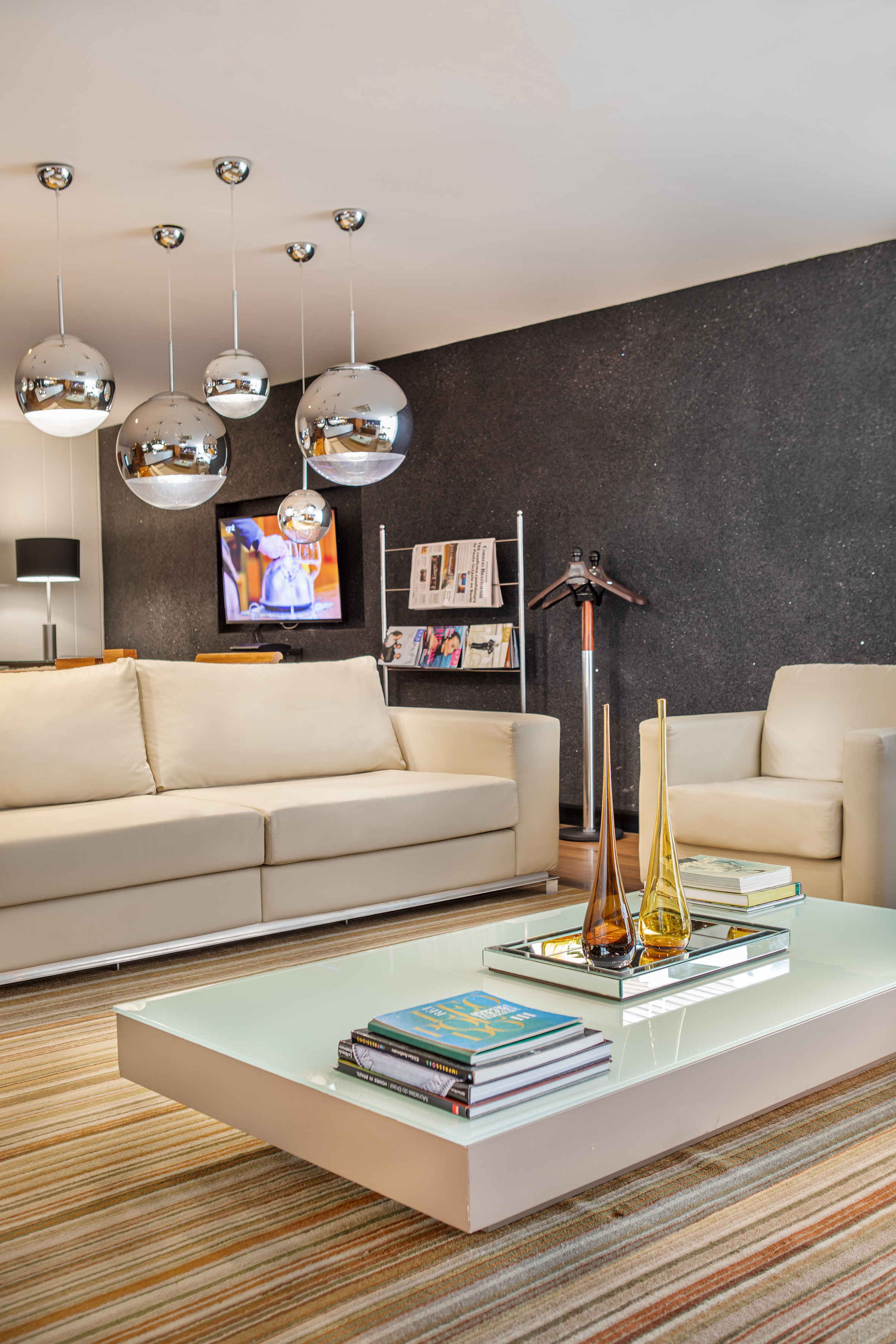 a living room with a white couch and a white coffee table
