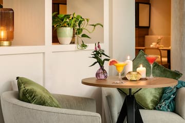 a table with drinks and candles on it