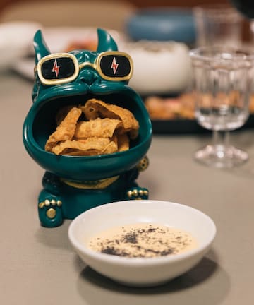 a bowl of food next to a bowl of food