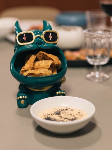 a bowl of food next to a bowl of food