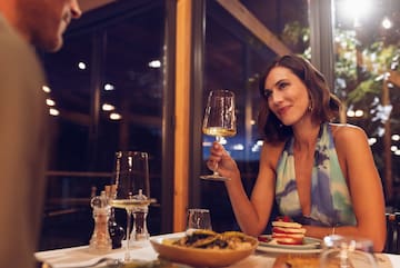 a woman holding a glass of wine