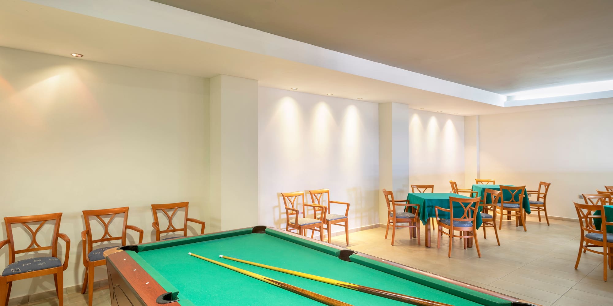 a pool table with a pool stick in it