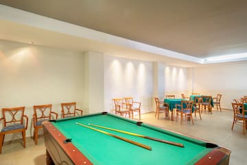 a pool table with a pool stick in it