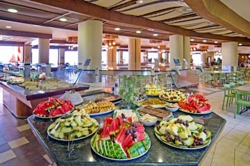 a pool with tables and chairs
