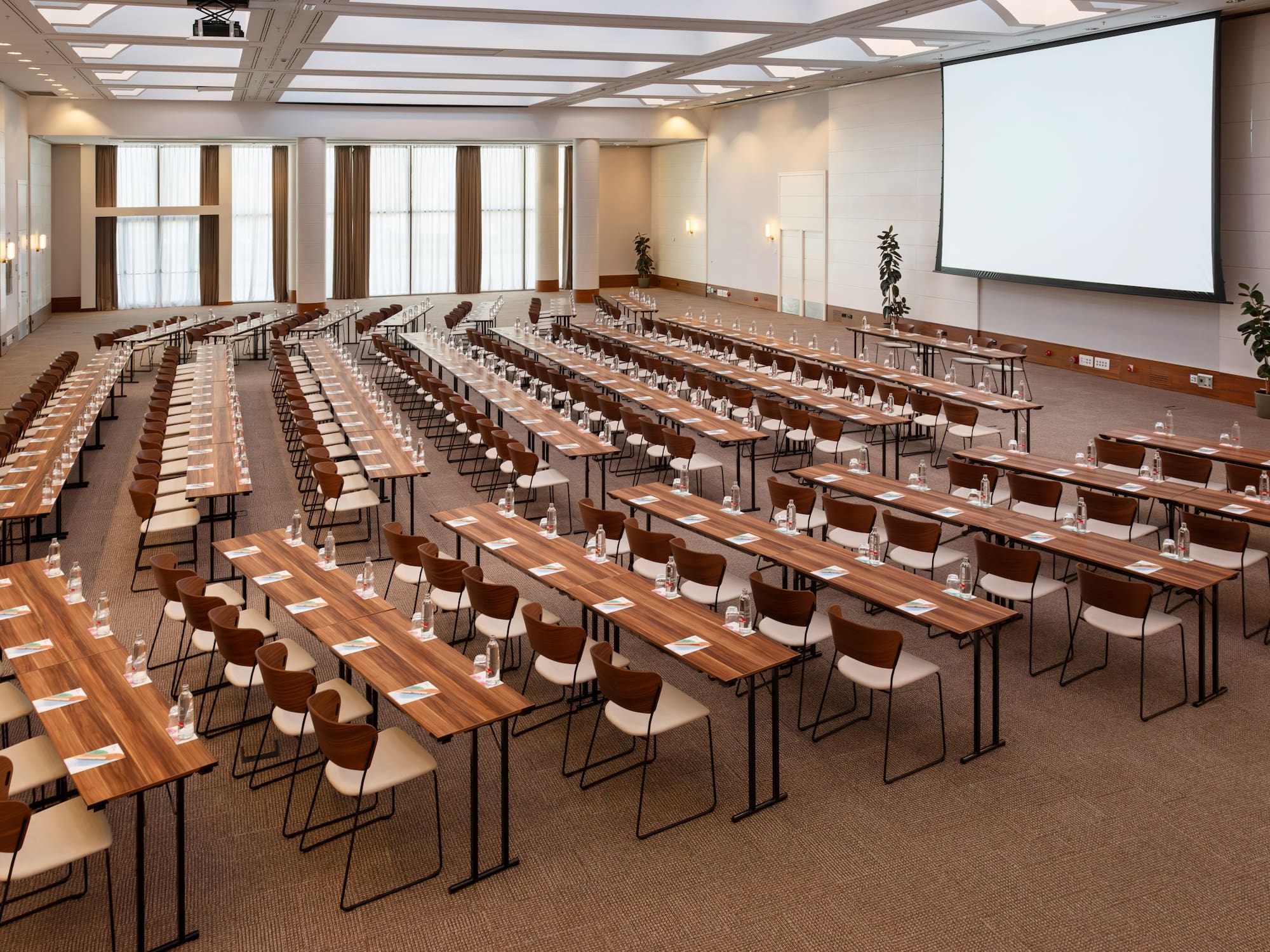 a large conference room with tables and chairs