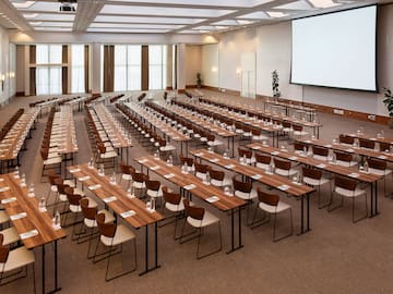 a large conference room with tables and chairs