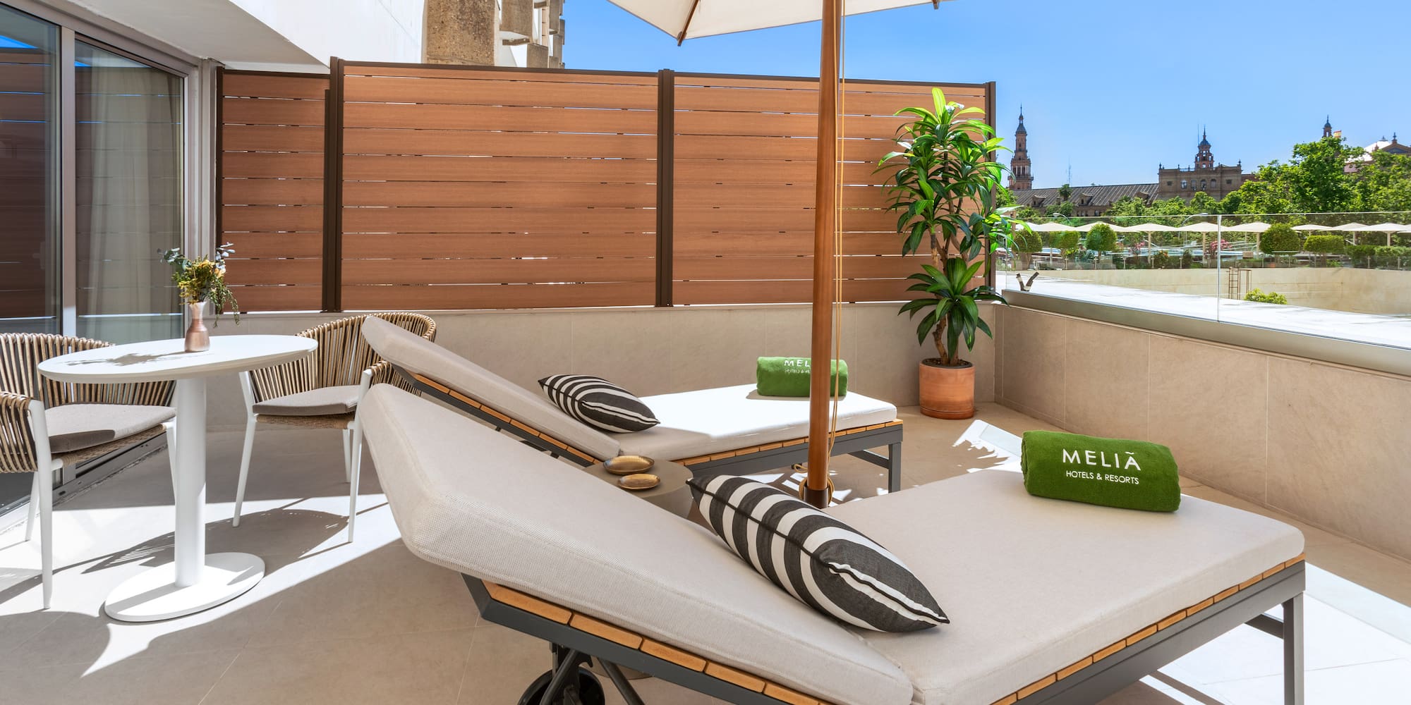 a deck with chairs and umbrellas