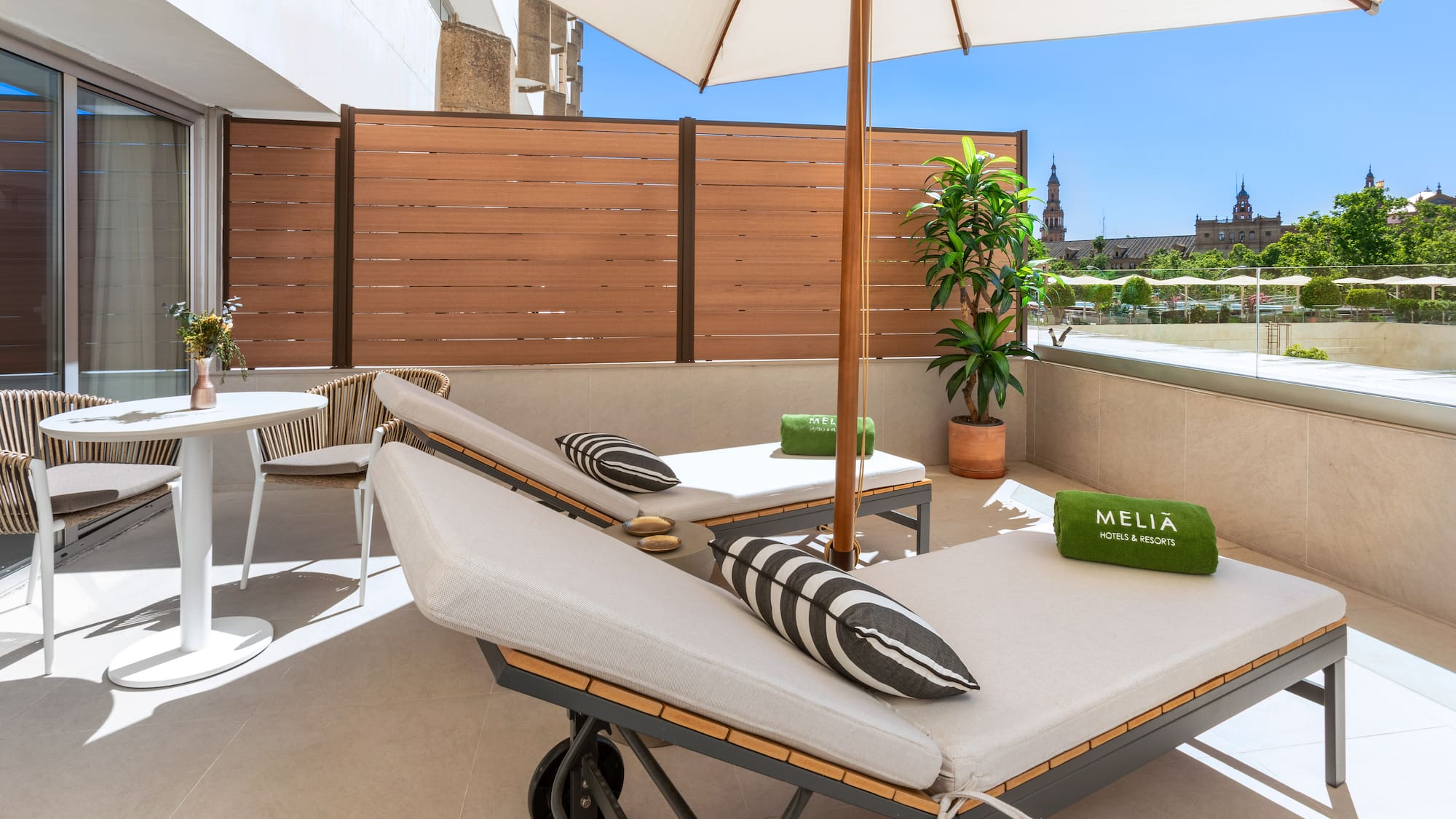 a deck with chairs and umbrellas