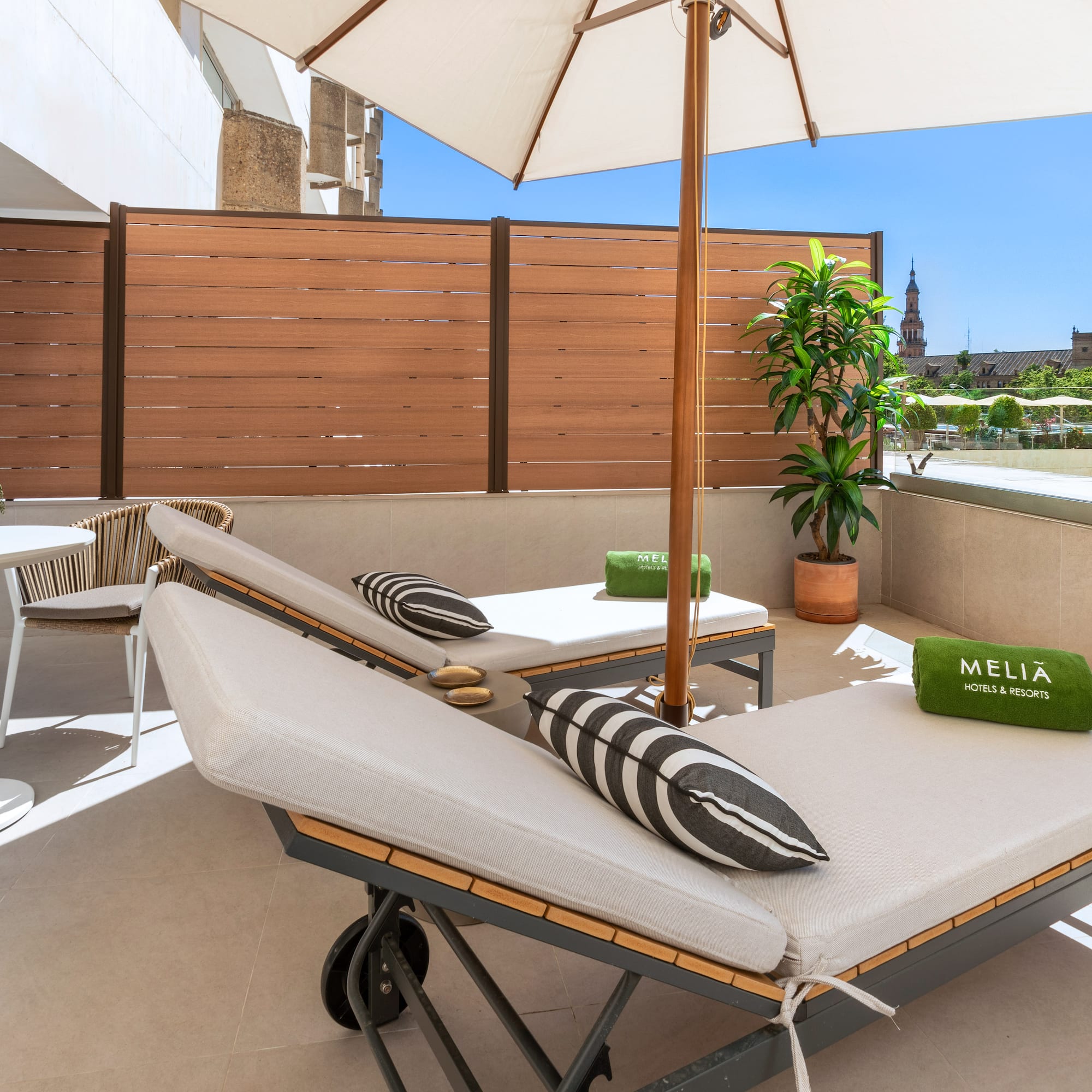 a deck with chairs and umbrellas