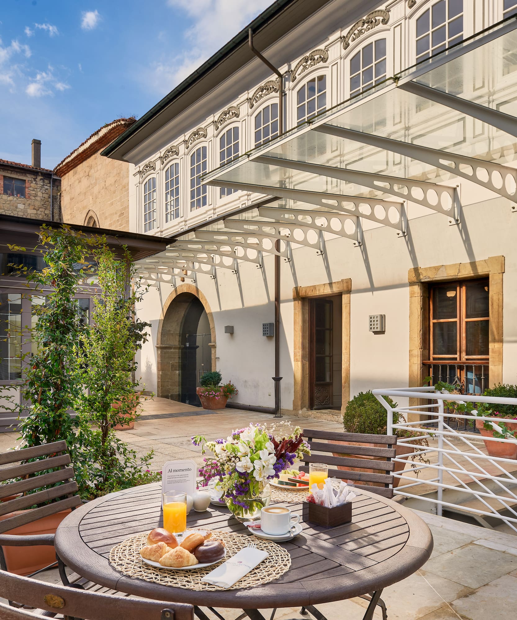 a table with food on it outside of a building