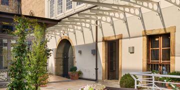 a table with food on it outside of a building