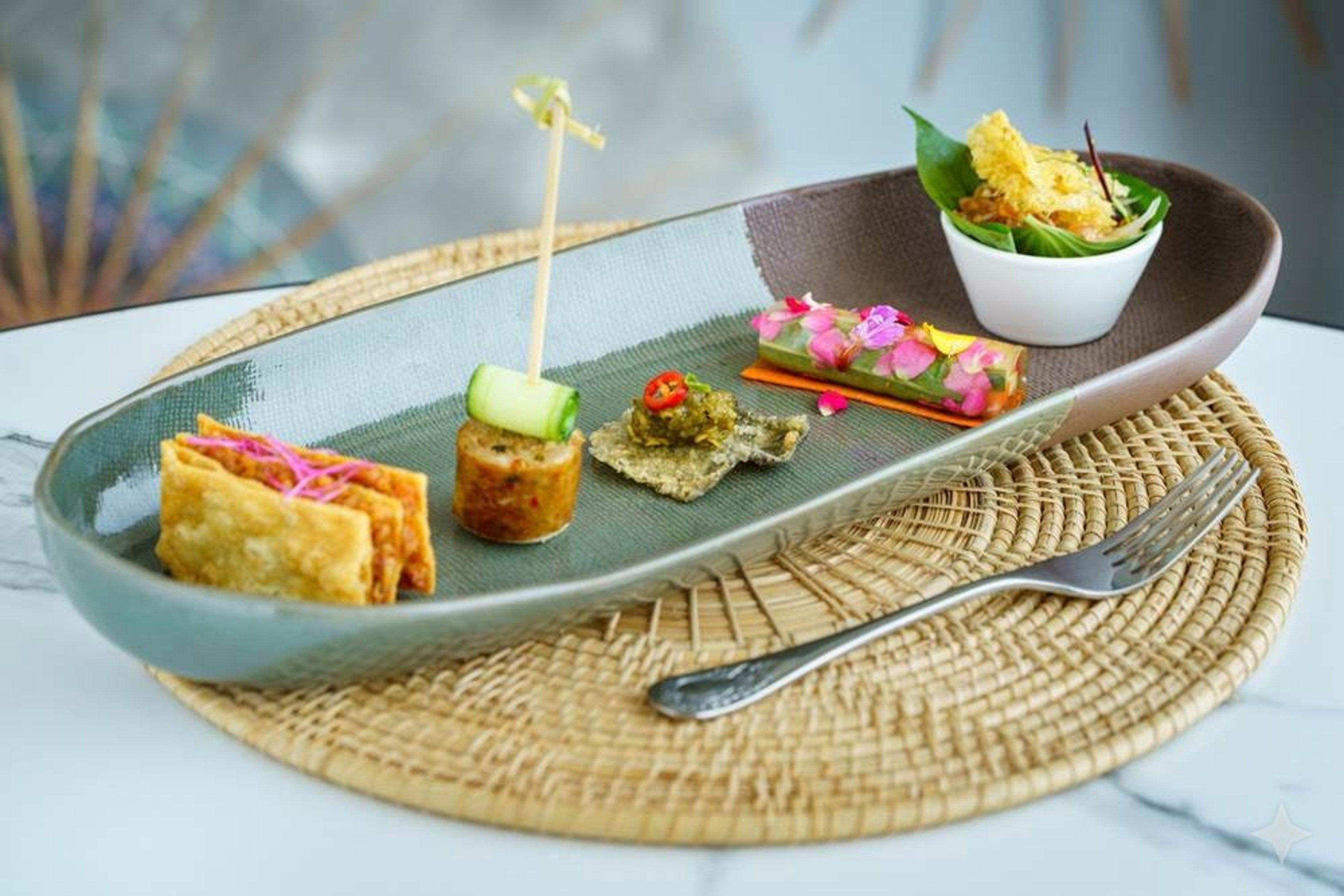Assortment of vibrant Asian appetizers, small bites, elegantly plated.
