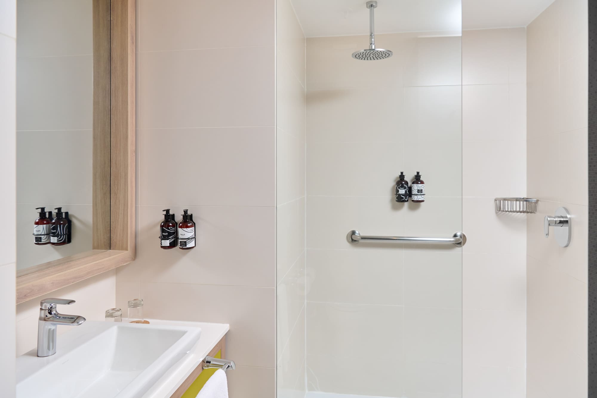 a bathroom with a shower and sink