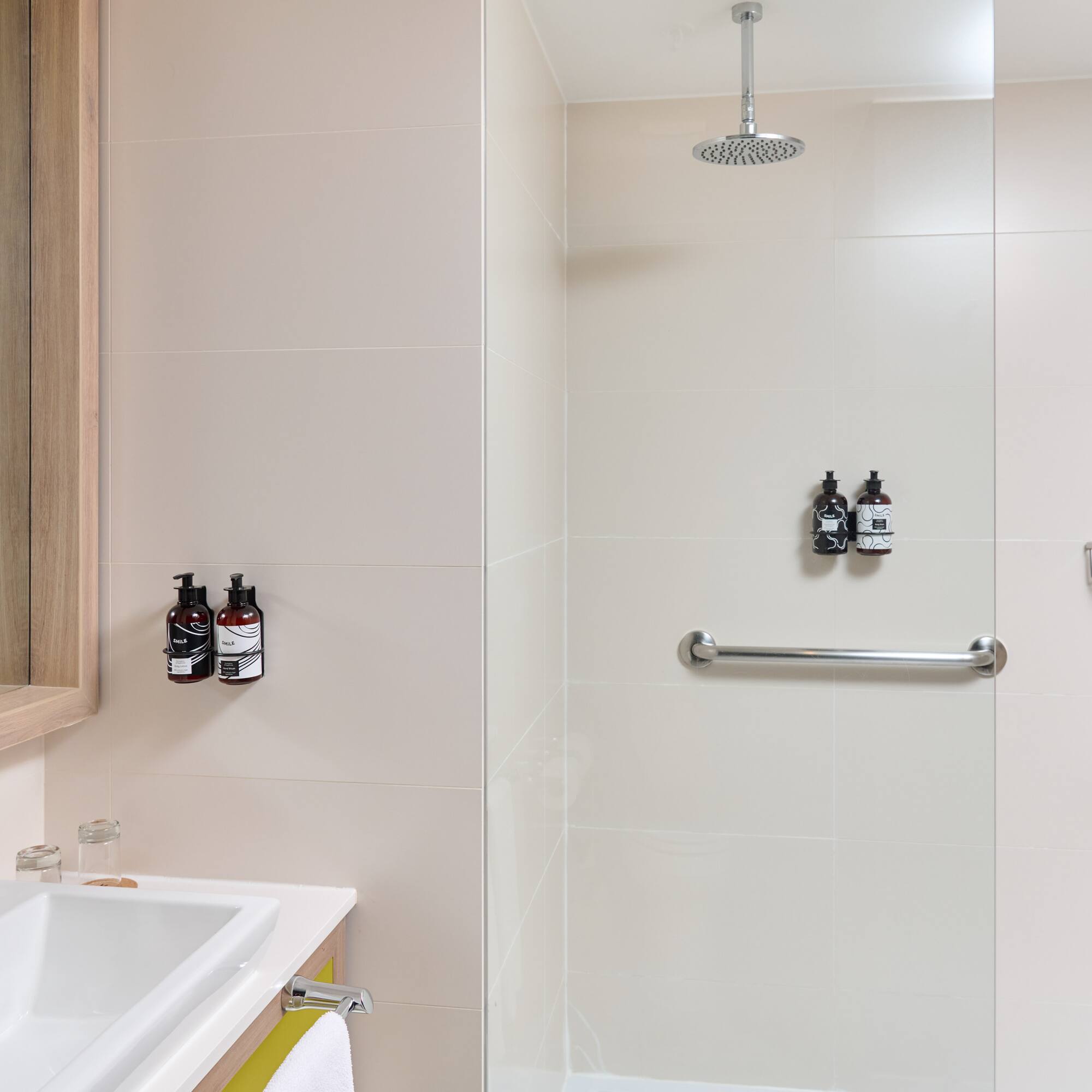 a bathroom with a shower and sink