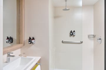 a bathroom with a shower and sink