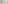 Modern hotel bathroom with sink, mirror, rainfall shower, and grab bar.