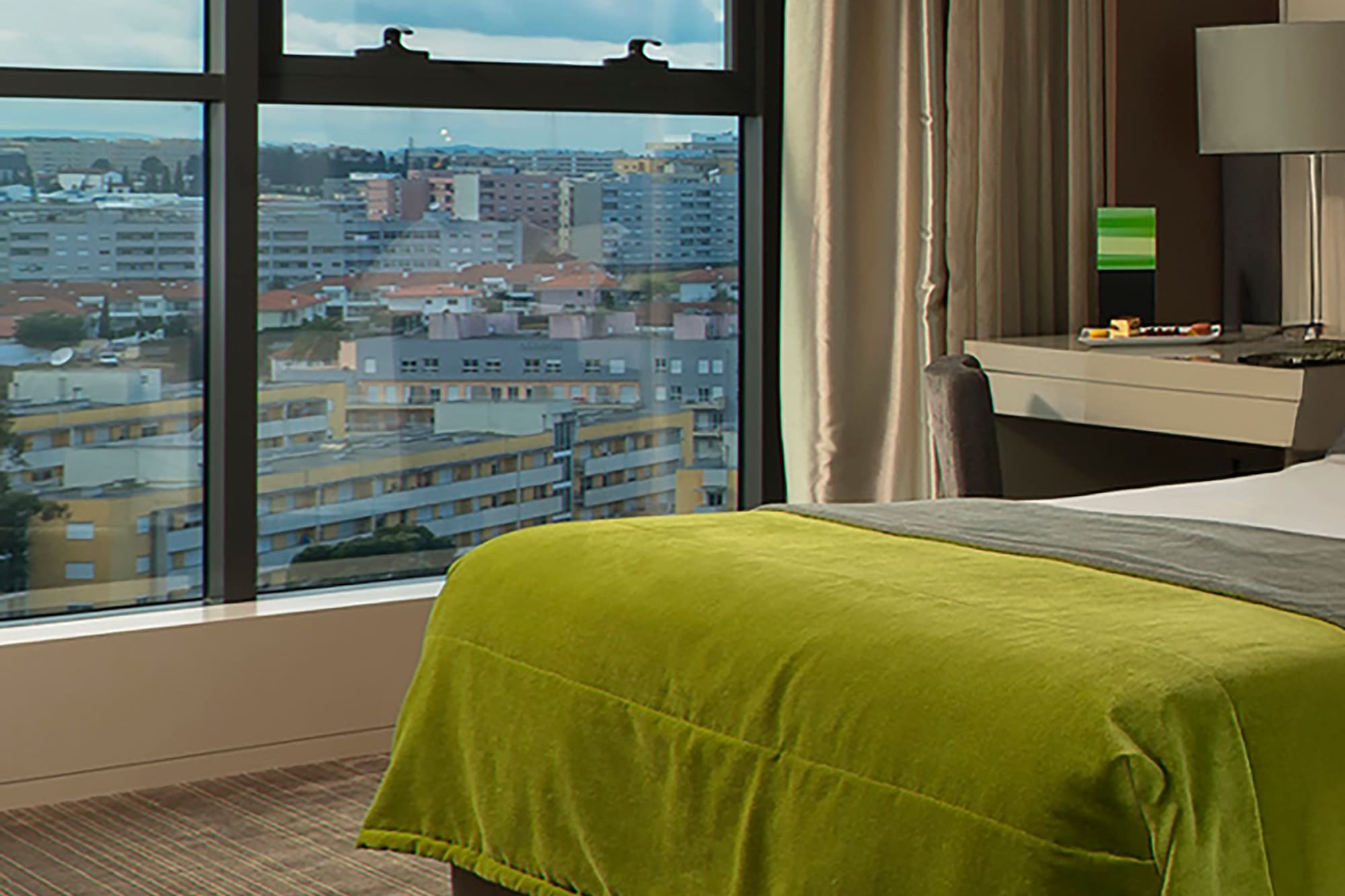 a bedroom with a large window